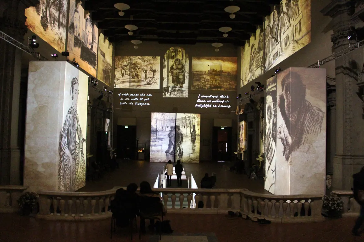 The nave of Santo Stefano al Ponte in Florence in 2014, lit by projections of Van Gogh’s paintings on tall freestanding panels